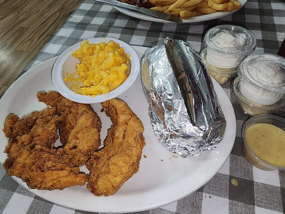 Hand Battered Chicken Strips Baked Potato and Mac and Cheese